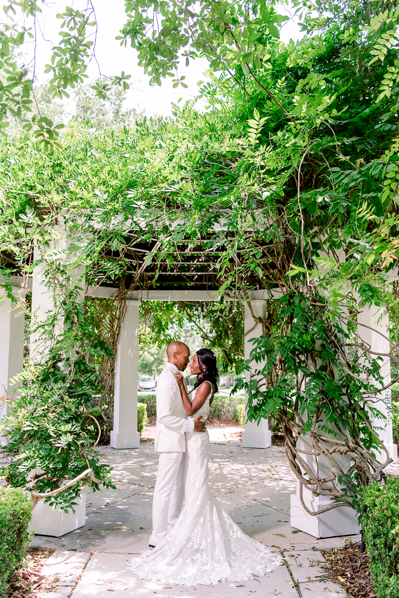 Cypress Grove Wedding | Estate House Wedding | Bride and Groom under archway