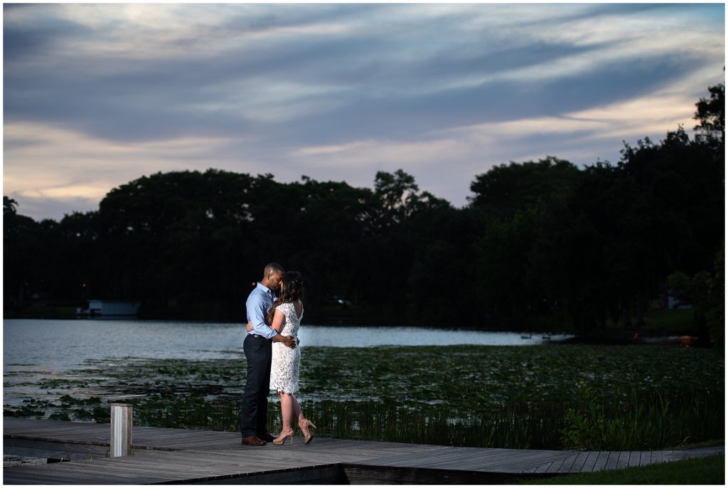 Bride and Groom standing on a boat dock at Rollins College