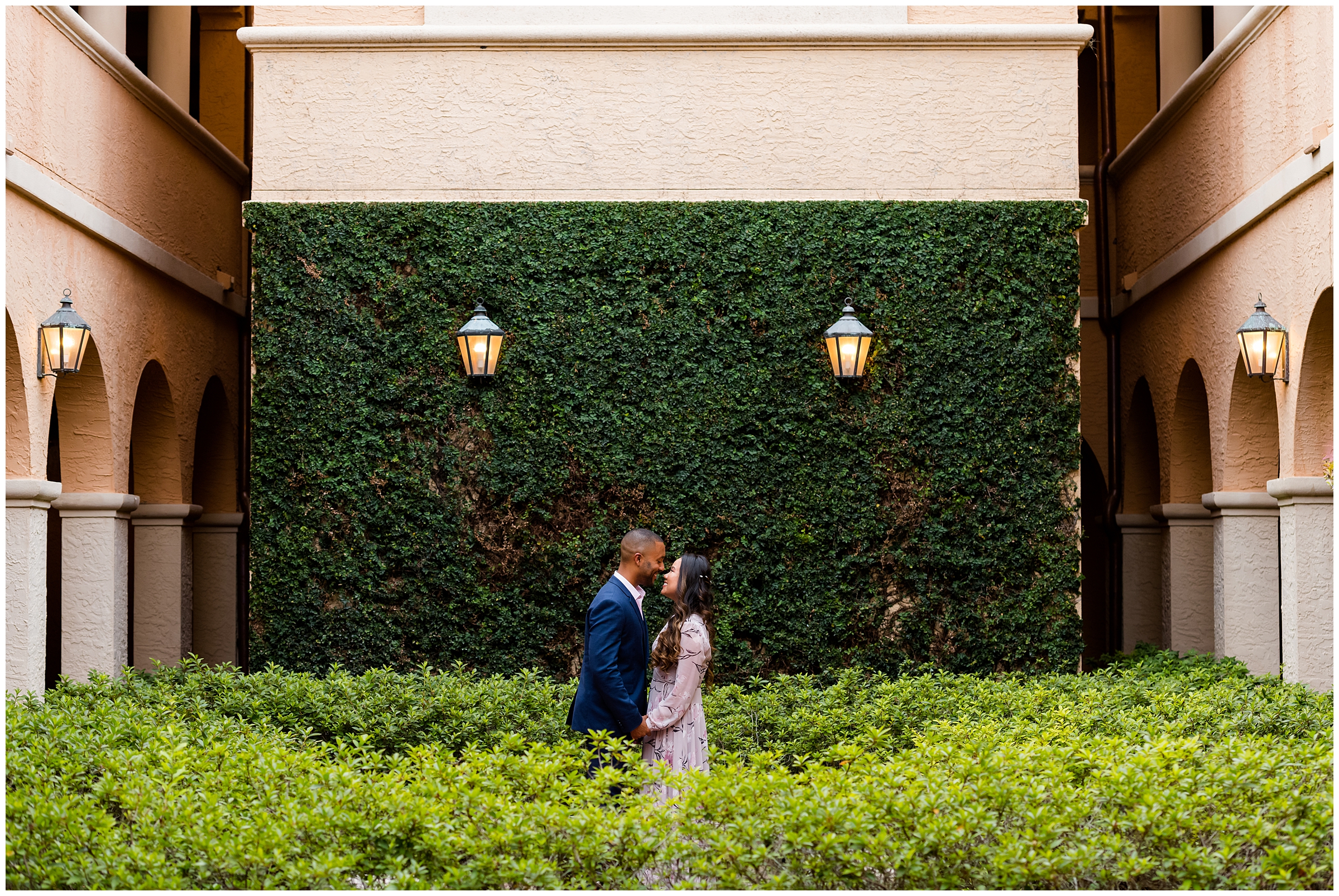 Bride and Groom portrait with greenery wall at Rollins College