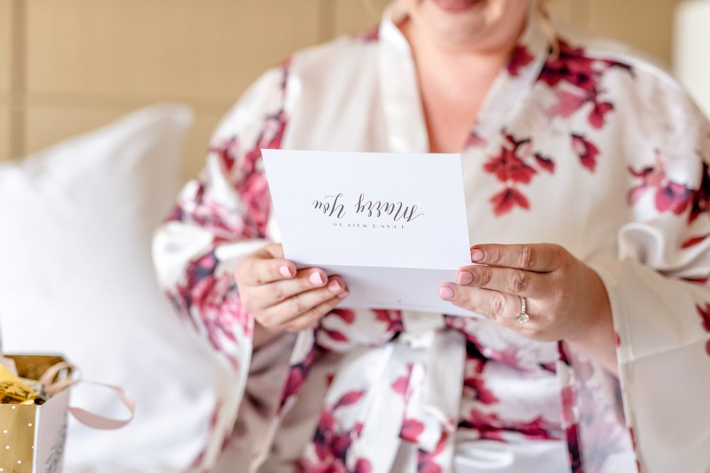 Bride reading letter from Groom | Four Seasons Wedding | Chynna Pacheco Photography