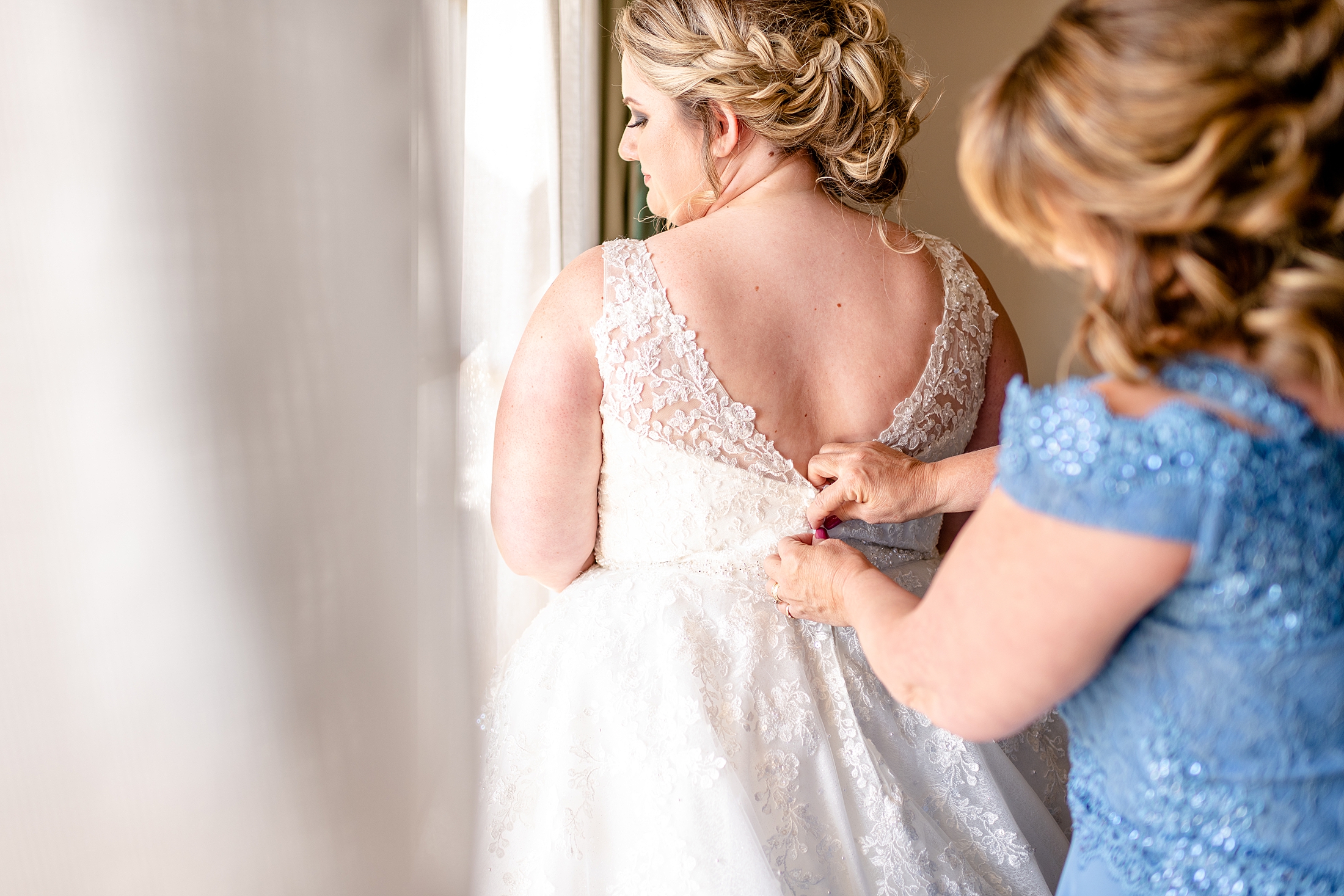 Mother helping bride button wedding dress | Four Seasons Wedding | Chynna Pacheco Photography