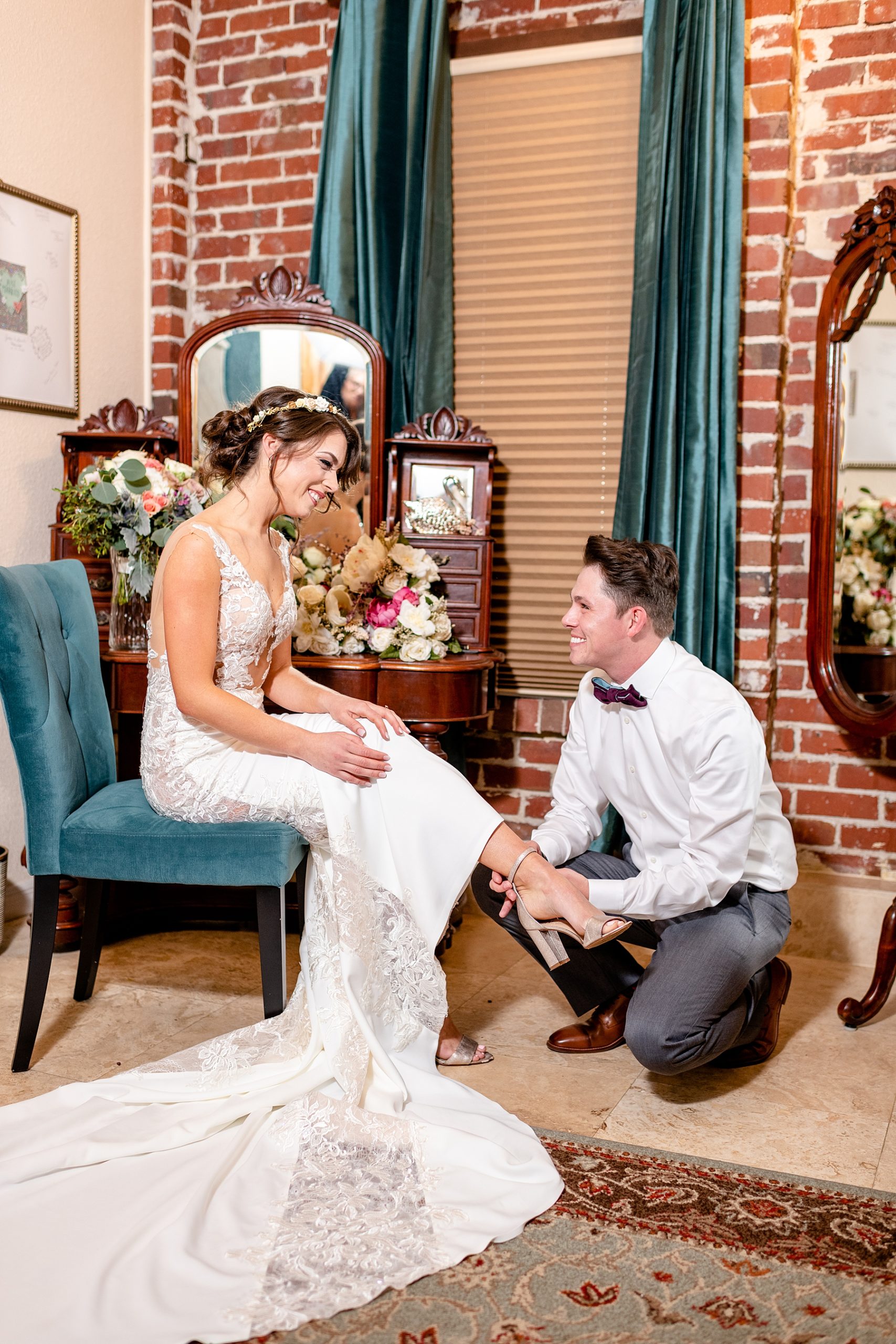 Bride putting wedding shoes on | Town Manor | Chynna Pacheco Photography