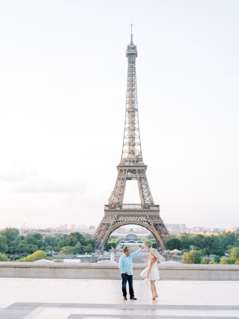 Couple dancing in front of Eiffel Tower in Paris
